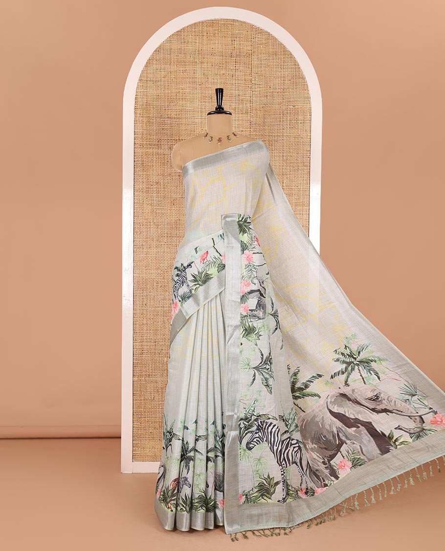 Grey wild-life theme printed Linen cotton saree, bavanji border, pallu of elephant, zebra, and flamingo designs, and coconut tree motifs printed blouse