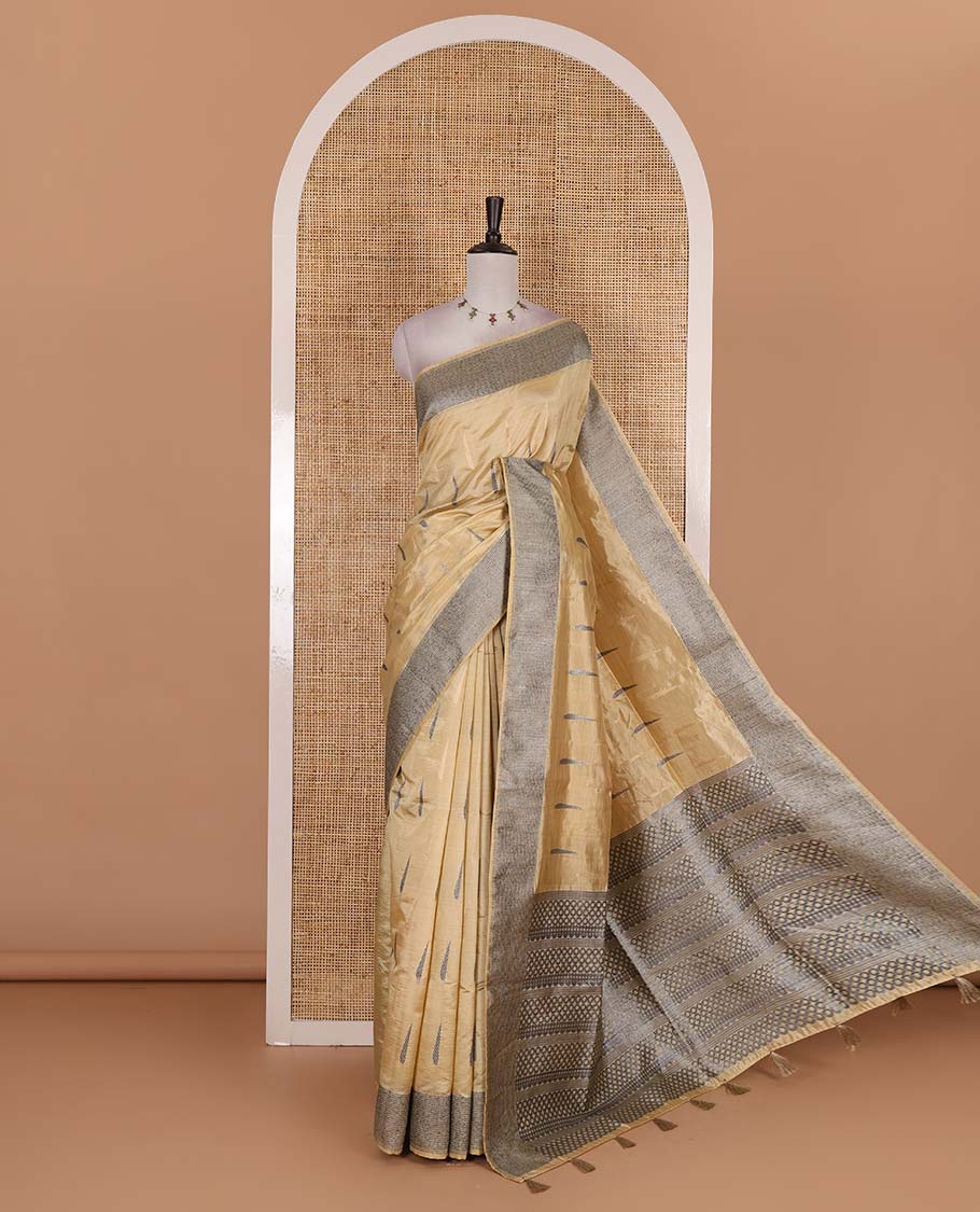 Sandal buttas woven semi-tussar saree, zari border, geometric patterned pallu, and a matching blouse