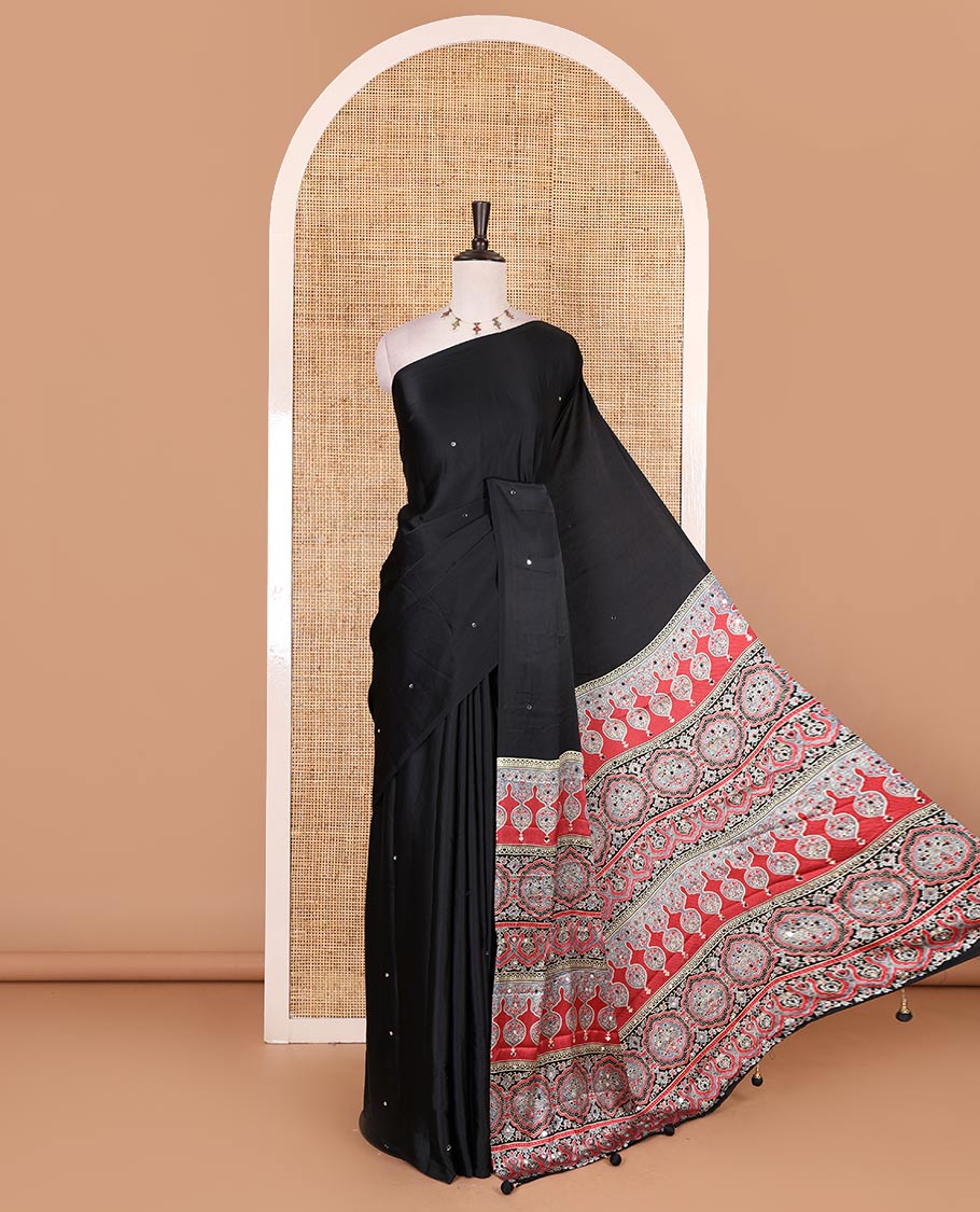 Borderless black mirror work Gaji silk saree, contrast ajrakh-style printed pallu, and intricately printed blouse