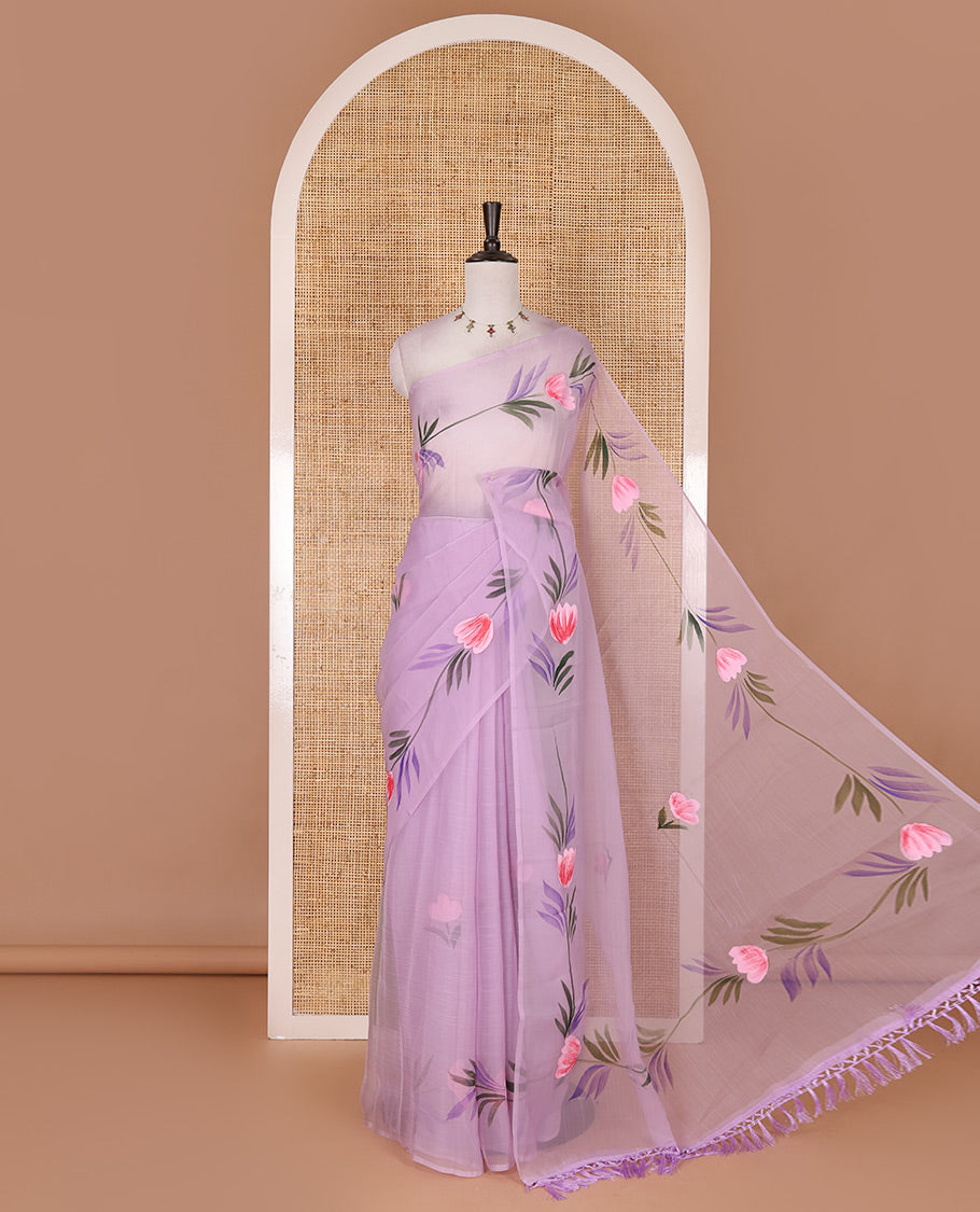 Borderless lavender floral motifs hand brush painted semi-organza saree comes with tasseled pallu and without blouse