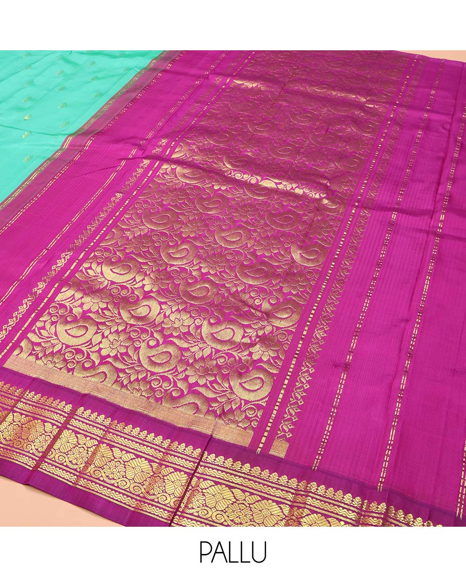 Blue Kanchipuram Silk Saree, Subtly Sparkled with Zari Buttas on Its Body, Complemented by a Contrast One-Sided Korvai Border of Rettai Neli, Banaras, and Floral Designs, Pallu of Paisley-Floral Designs, and Comes Without a Blouse