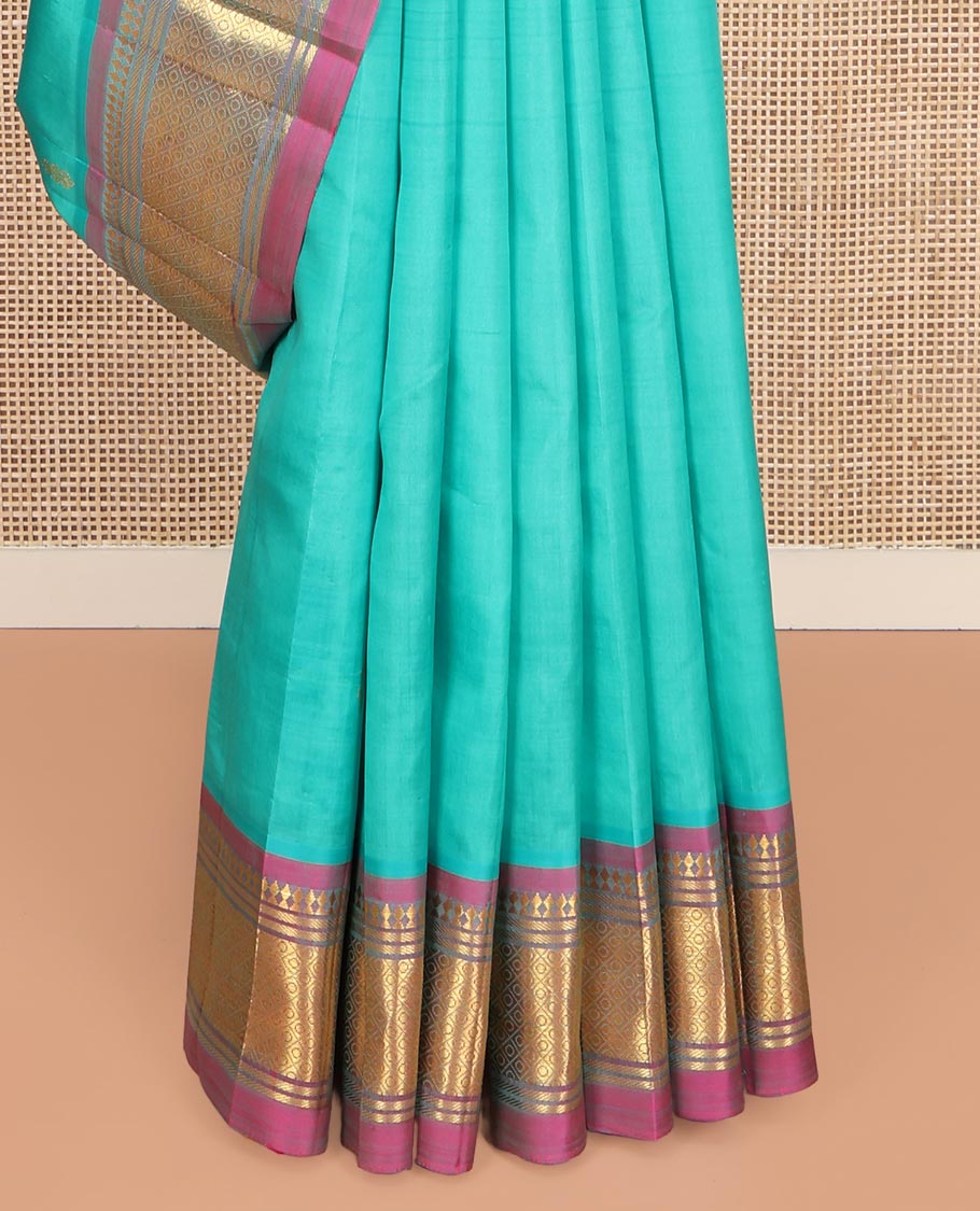 Blue Kanchipuram Silk Saree, Bedecked with Zari Buttas on Its Body, Complemented by a Contrast One-Sided Border of Panner Sombu, Banaras, and Jaal Designs, Pallu Features Floral Creeper Designs, and Comes Without a Blouse