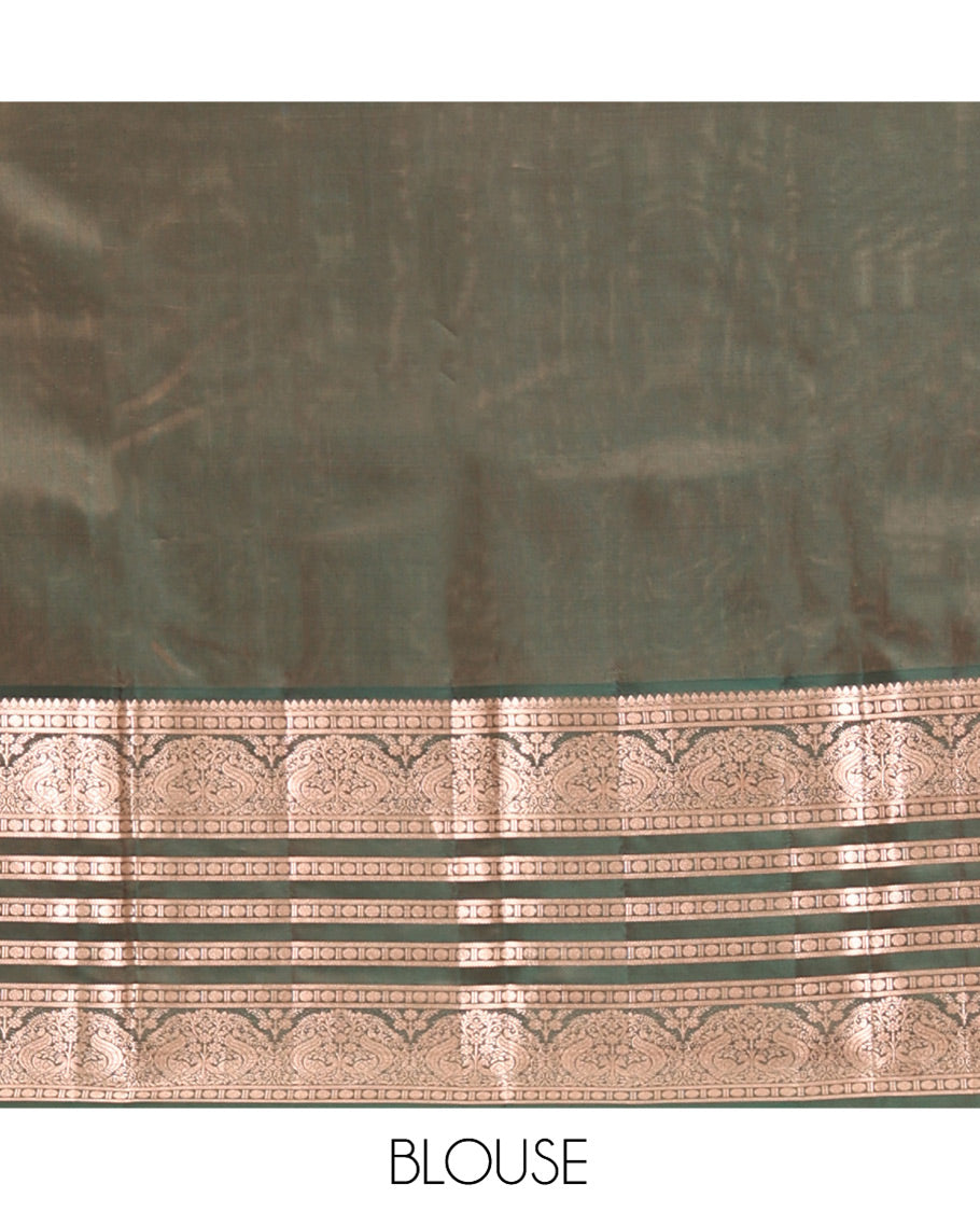 Mustard Vasundhara Lite Silk Mix Saree, Richly Detailed with Zari Buttas and Stripes All Over Its Body Complemented by Contrast Border of Thilakam Mokku, Rudraksham, and Mayil Designs, Grand Jaal Pallu, and Paired with a Contrast Blouse