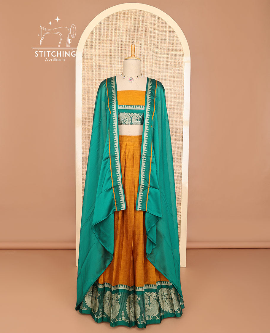 Mustard half saree with contrast peacock design border, embroidered blouse & plain, temple border dhavani