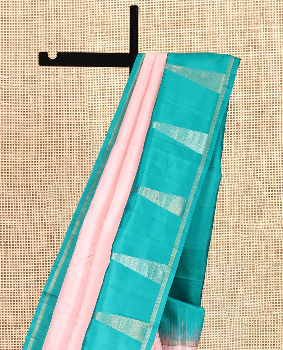 Peach Kanchipuram Silk Saree, Sparsely Woven with Buttas, Complemented by a Contrast Thazampoo Rekku Border, Chevron Striped Pallu, and a Contrast Blouse