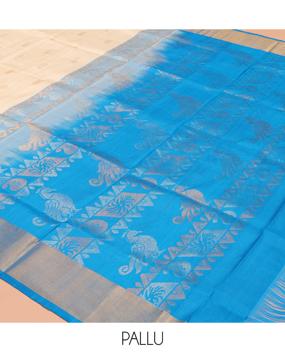 Cream Uppada Silk Saree, Subtly Sparkled with Zari Buttas All Over Its Body, Complemented by a Contrast Bavanji Border, Pallu Features Peacock Designs, and Paired with a Contrast Blouse