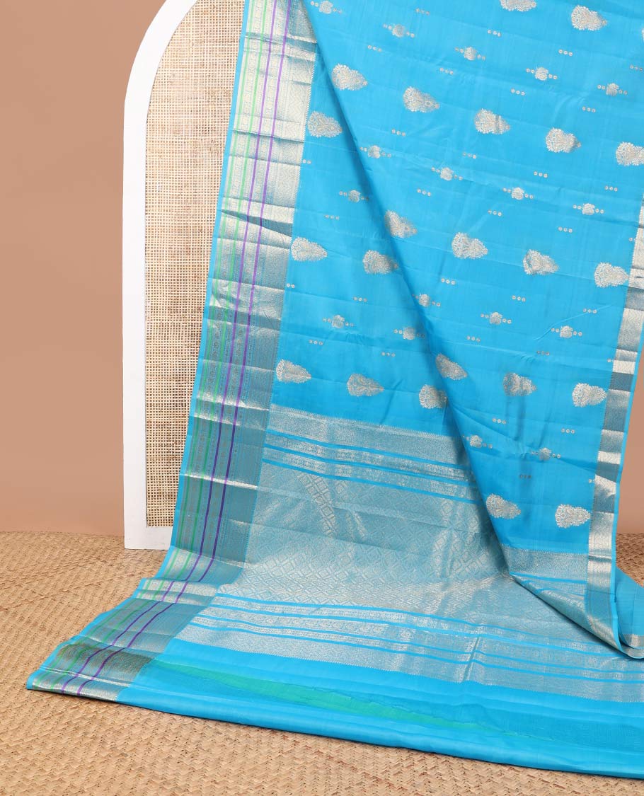 Sky blue motifs vasundhara elite silk saree with contrast border of intricate zari design & checked floral design pallu
