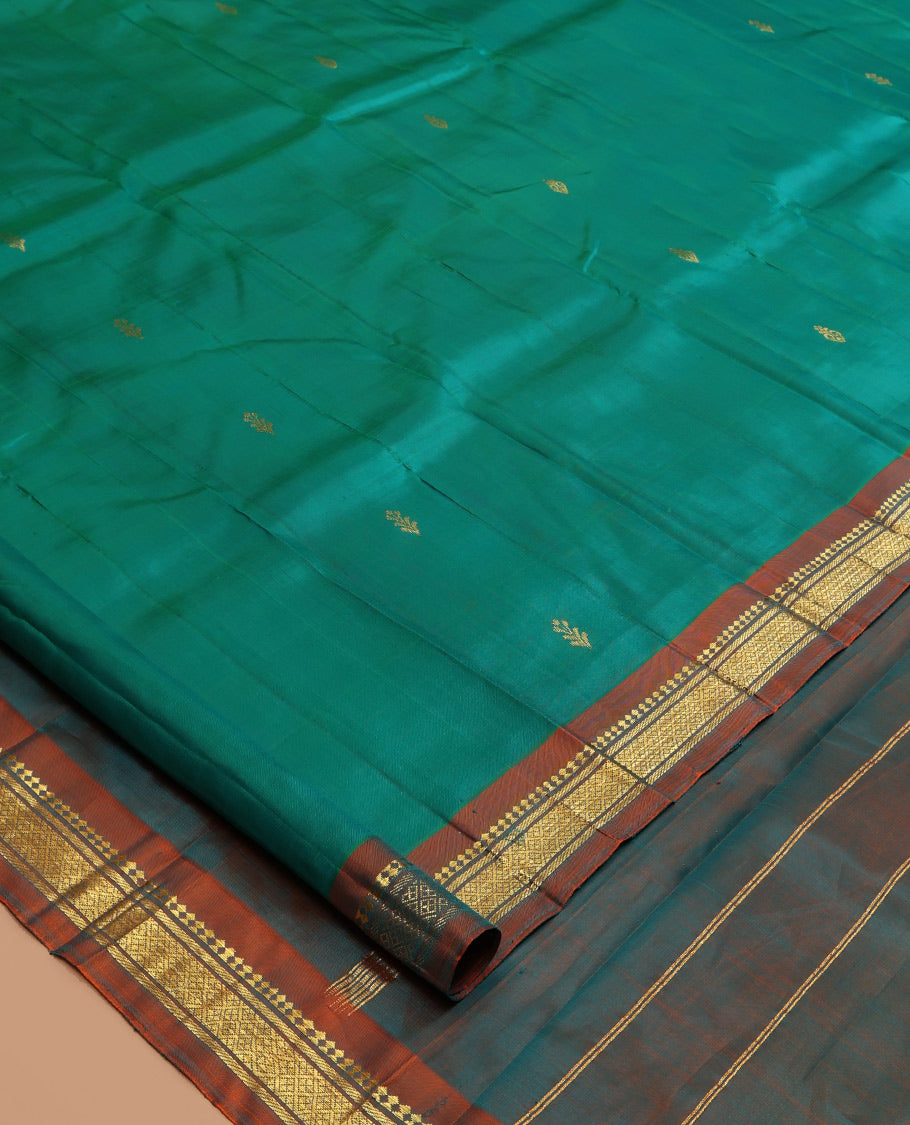 Green Kanchipuram Silk Saree, Woven with Zari Buttas, a Contrast One-Sided Border of Panner Sombu, Banaras, and Jaal Designs, Zari Design Pallu, and No Blouse