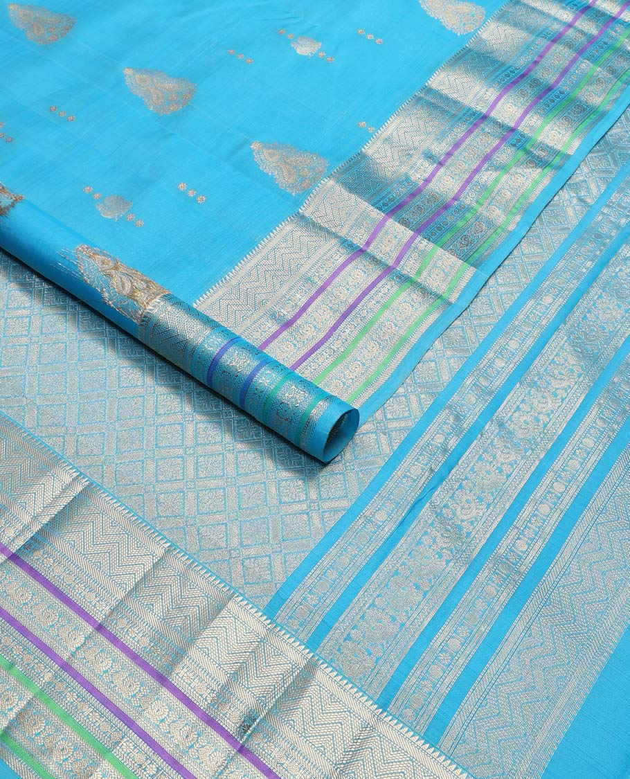 Sky blue motifs vasundhara elite silk saree with contrast border of intricate zari design & checked floral design pallu