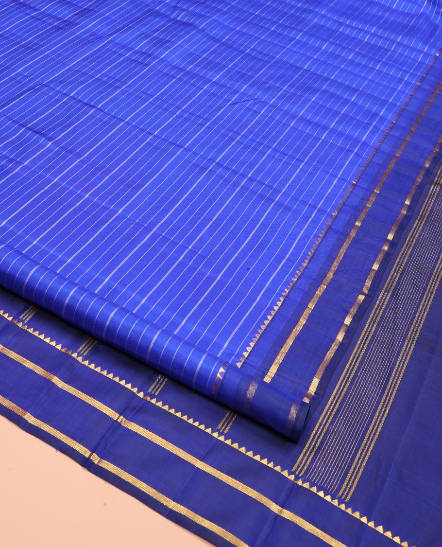 Blue Kanchipuram Silk Saree, Elevated with Stripes All Over Its Body, Complemented by Contrast Temple Zari Border, Subtly Zari-Striped Pallu, and Paired with a Contrast Blouse