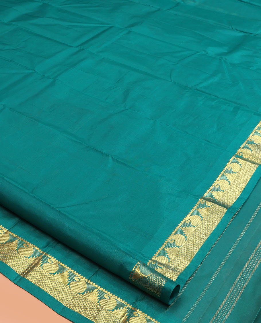 Green Kanchipuram Silk Saree, Woven with Zari Buttas, Highlighted by Zari Border of Rekku, Muthu, Manga, and Mayil Kann Designs, Pallu of Zari Design, and a Matching Blouse