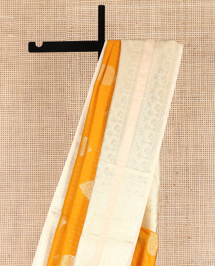 Yellow Budget Silk Saree, Steeped in the Richness of Zari Buttas All Over Its Body, Complemented by Contrast Varisai Pettu Traditional Zari Design Border, an Intricately Designed Pallu, and Paired with a Contrast Blouse