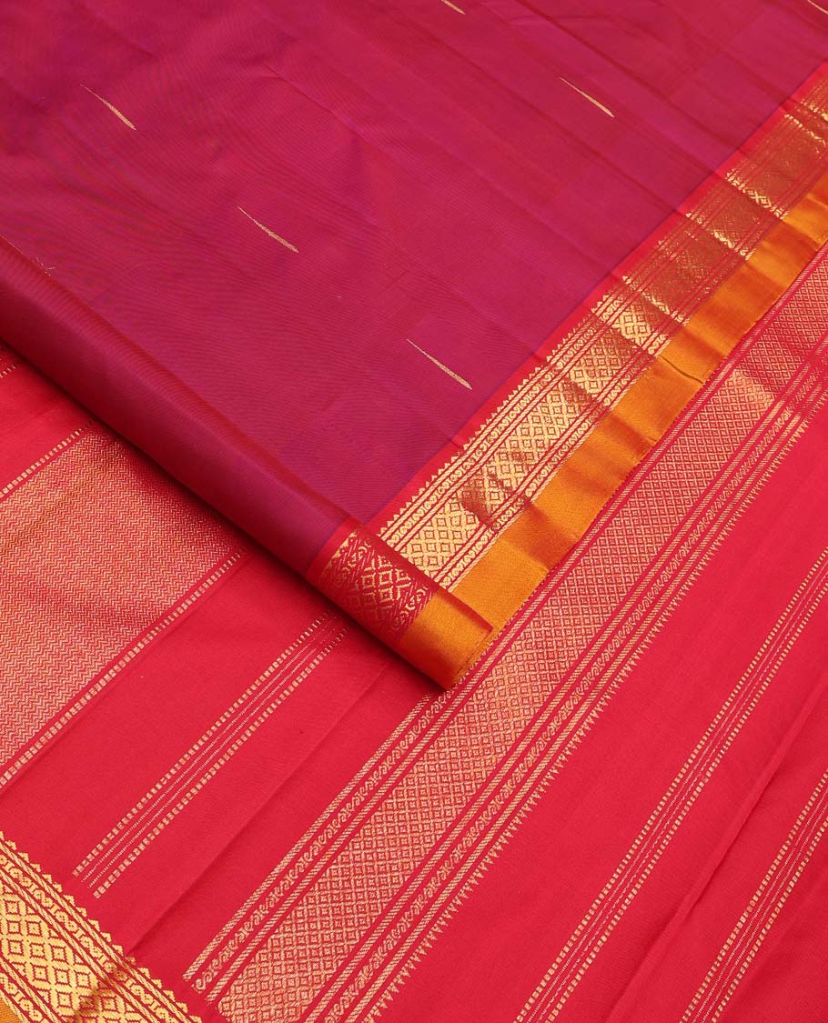 Magenta malli mokku buttas Kanchipuram silk saree, contrast border of rekku, banaras, and mayil kann designs, and traditional design pallu