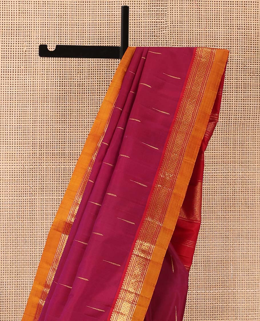 Magenta malli mokku buttas Kanchipuram silk saree, contrast border of rekku, banaras, and mayil kann designs, and traditional design pallu