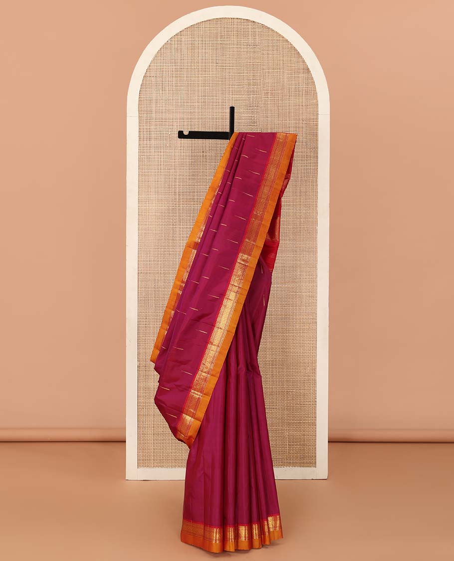 Magenta malli mokku buttas Kanchipuram silk saree, contrast border of rekku, banaras, and mayil kann designs, and traditional design pallu
