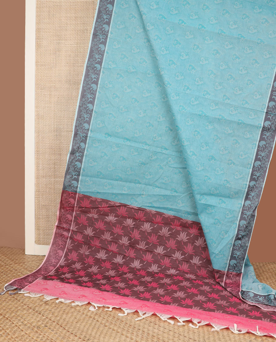 Blue spade-patterned Coimbatore cotton saree, floral creeper border, & contrast lotus motifs pallu