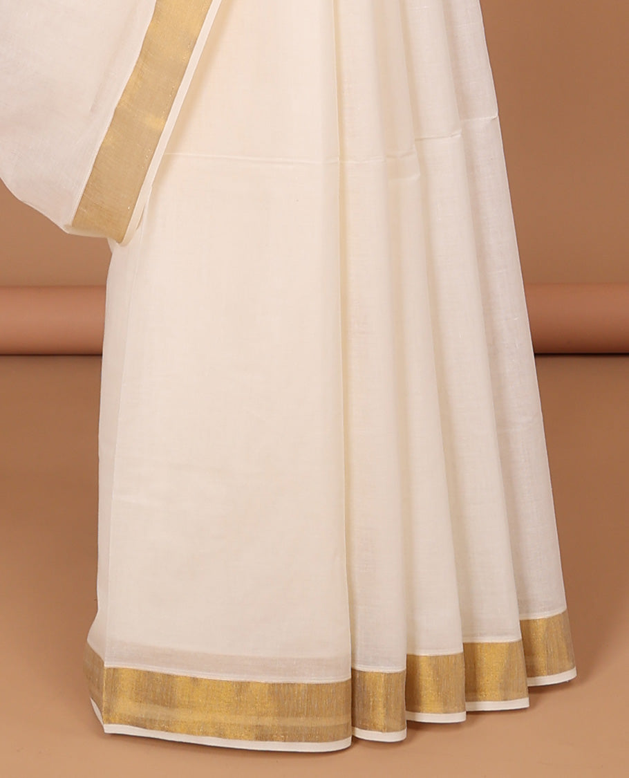 Cream kerala saree, zari border & pallu of peacock zari designs