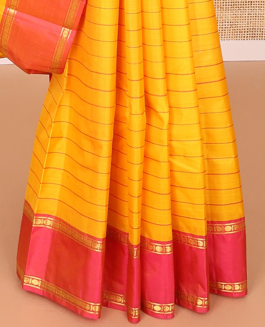 Orange striped kancheepuram silk saree with contrast rettai pettu border of banaras, paun design & zari design pallu