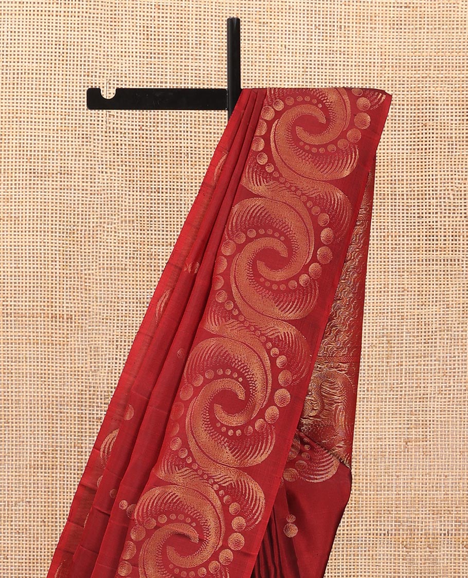 Red soft silk saree with zari buttas, spiral shaped zari woven border & zig-zag striped pallu