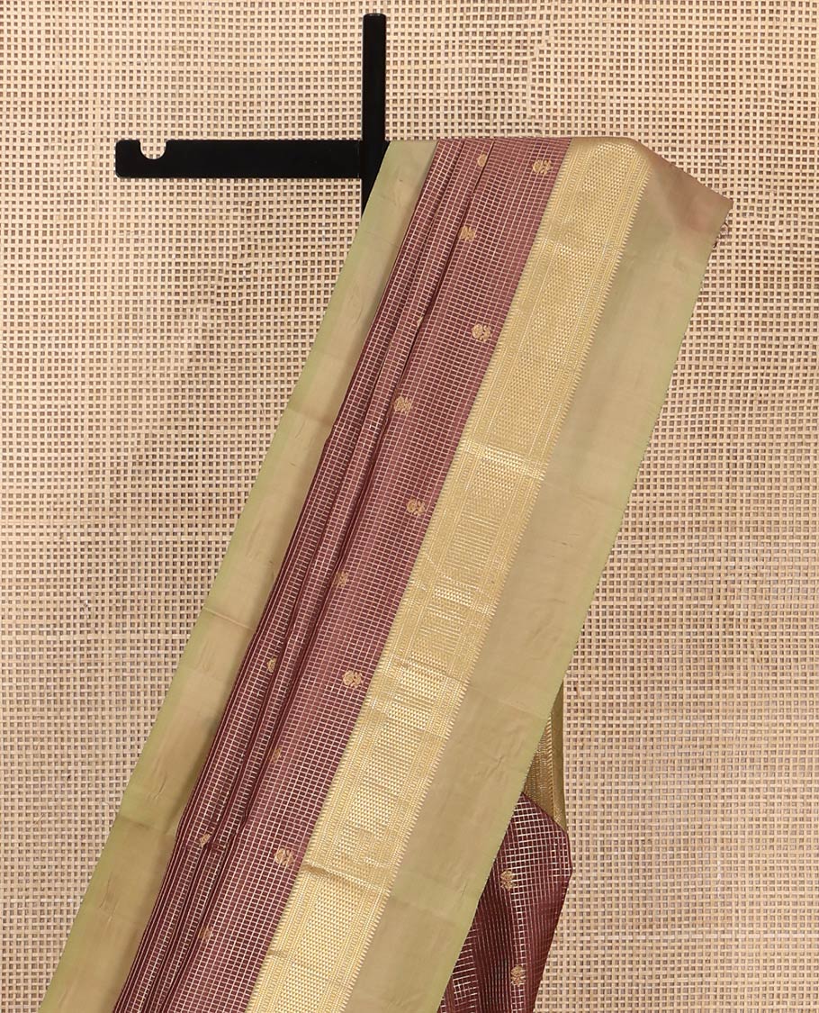 Brown Vasundhara Silk Saree, Prettified with Zari Buttas and Checks All Over Its Body, Complemented by a Contrast Kal Eragina Border of Ara Bogudi, Muthu, and Ara Maadam Designs, Grand Jaal Pallu, and Paired with a Contrast Blouse