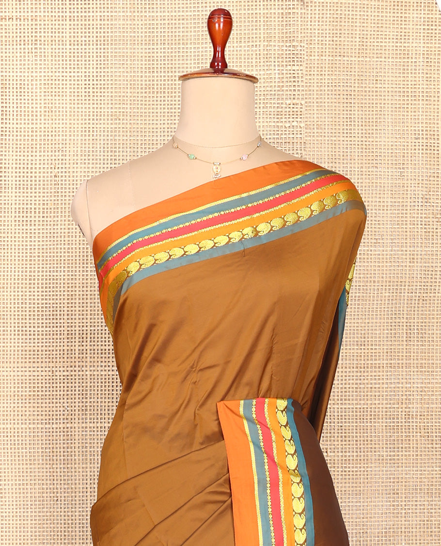 Brown Plain Aarani Silk Saree, Complemented by a Contrast Traditional Zari Design Border, Zari Striped Pallu, and Paired with a Contrast Blouse