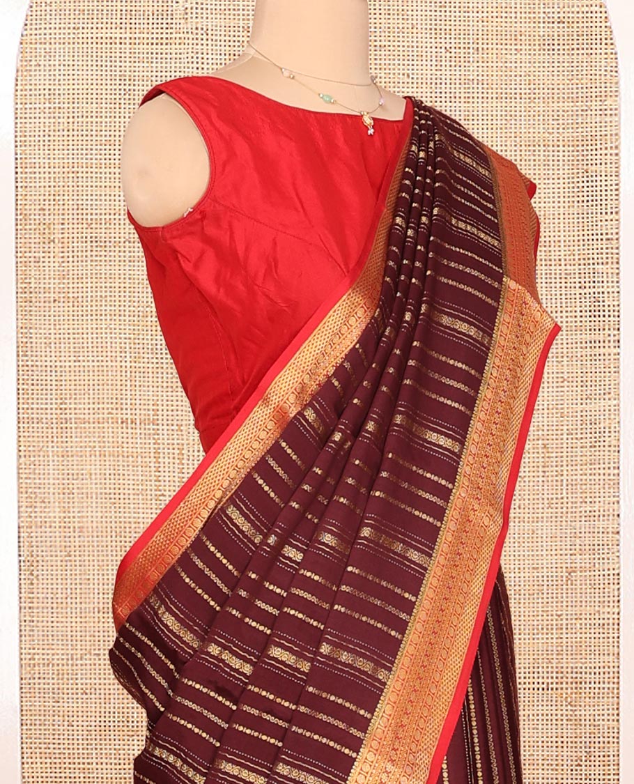 Brown Mysore Silk Saree, Spotlighted By Geometric Zari Designs All Over Its Body, Complemented by Captivating Contrast Border of Traditional Zari Designs, Gleaming Zari Striped Pallu, and Paired with a Contrast Blouse