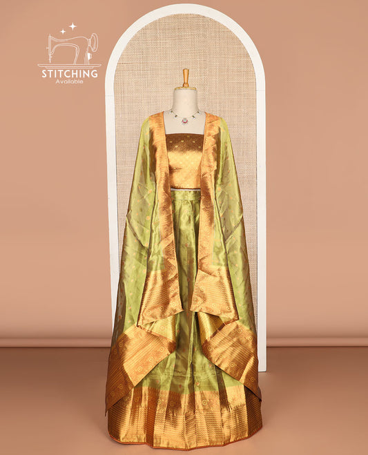 Light green  buttas tissue half saree with contrast zari design border, zari design blouse & floral design dhavani