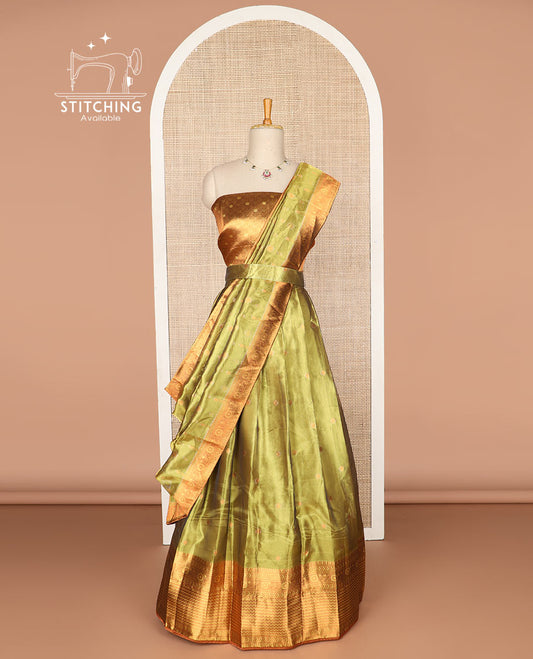 Light green  buttas tissue half saree with contrast zari design border, zari design blouse & floral design dhavani