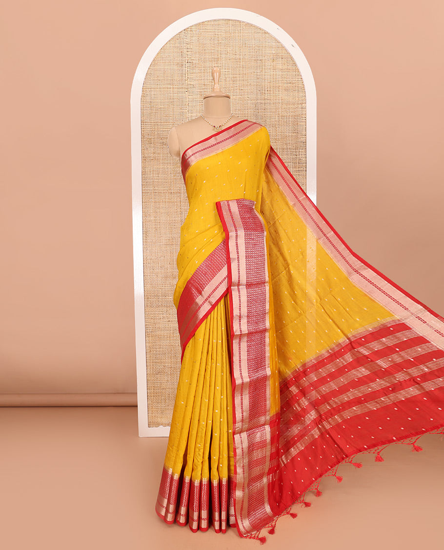 Yellow Assam Silk Saree Adorned with All-Over Buttas, Featuring a Contrast Temple Border of Butta Enclosed Checked Design, a Pallu Steeped with Zari Stripes, and Paired with a Contrast Zari Design Blouse