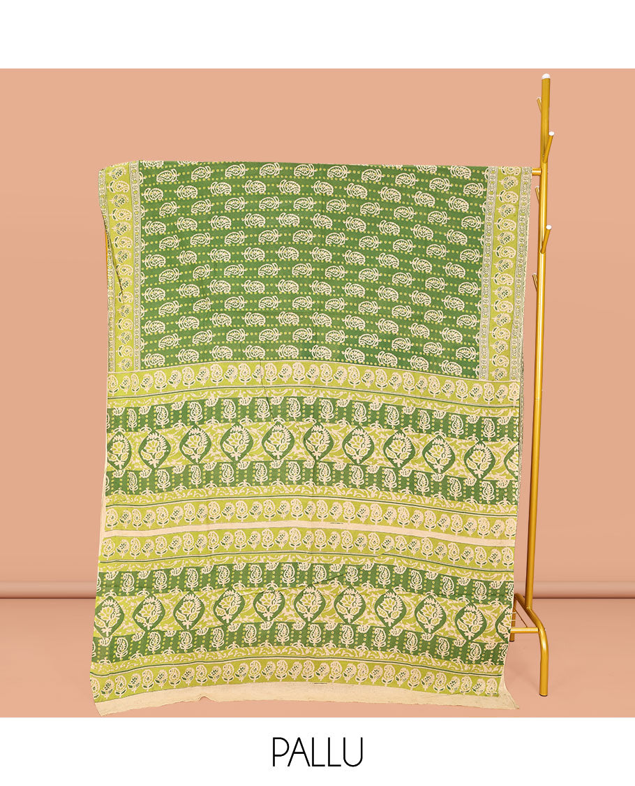 Light Green Machine-Printed Kalamkari Cotton Saree, Steeped with Paisley Motifs on Its Body, Complemented by a Contrast Paisley Printed Border, Pallu Steeped with Paisley Print, and Paired with a Printed Blouse
