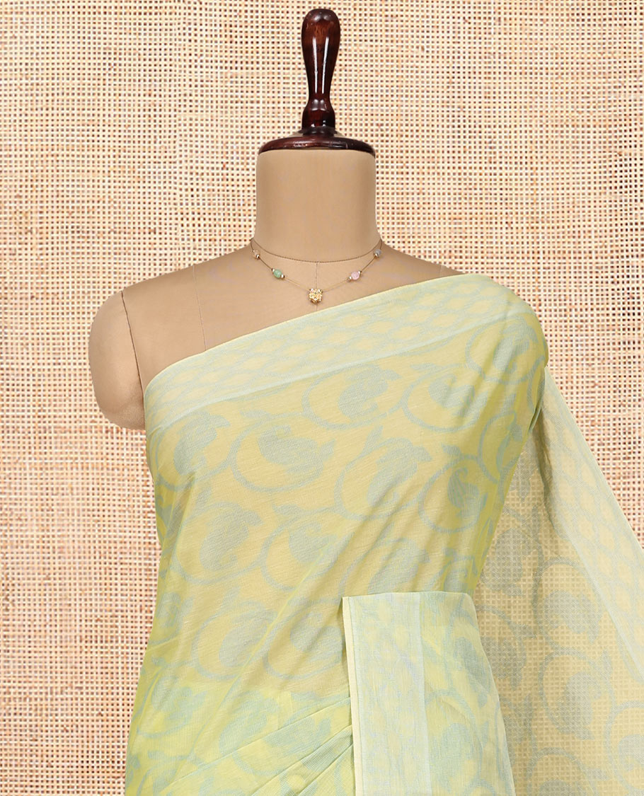Pale Green Coimbatore Cotton Saree, Sparsely Woven with Floral Creeper Design on Its Body, a Subtle Diamond Border, Pallu of Ogee Patterns, and Paired with Matching Blouse