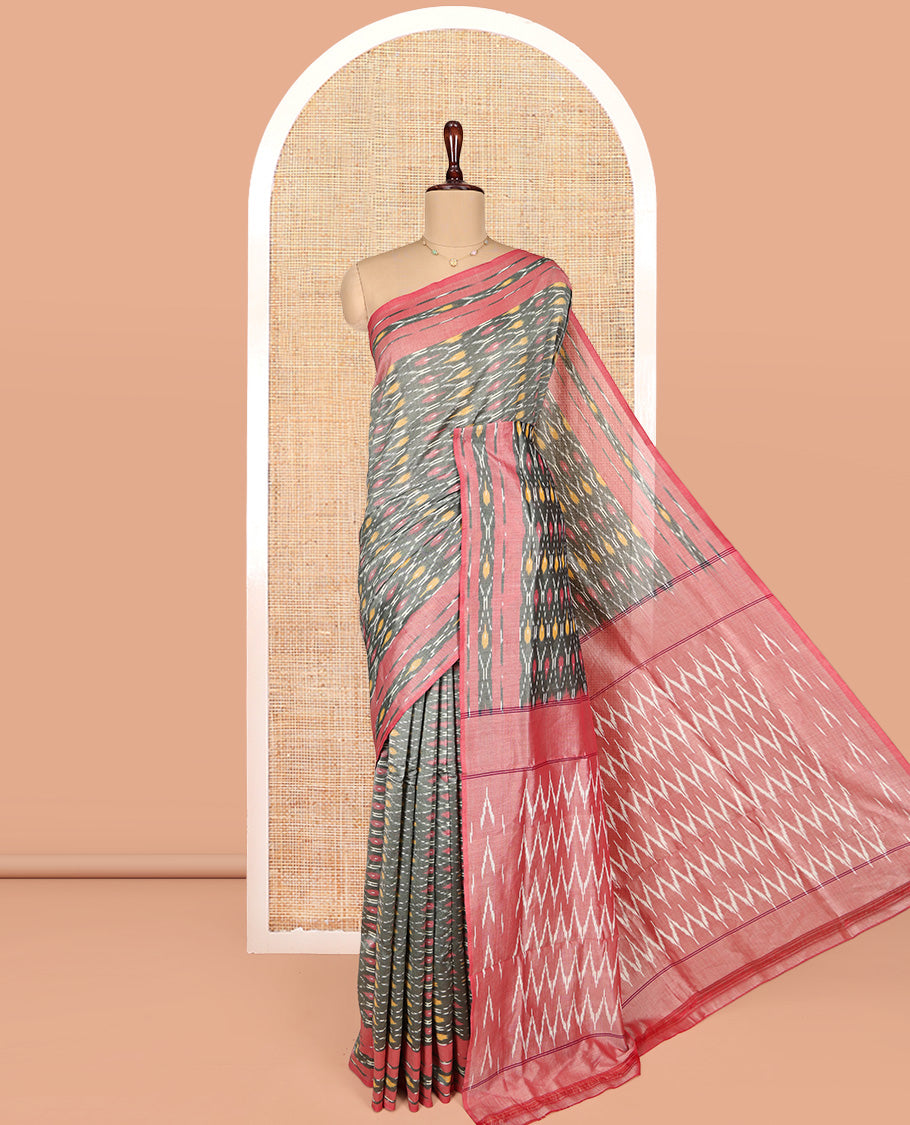Grey Ikkat Cotton Saree, Enriched with Ikkat-Style Ogee Patterns All Over Its Body, Complemented by a Contrast Ikkat-Style Border, Pallu of Chevron Patterns, and Has No Blouse