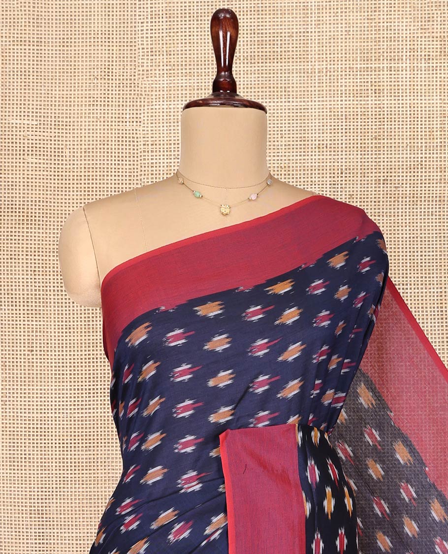 Blue Ikkat Cotton Saree, Embellished with Ikkat-Style Buttas on Its Body, Complemented by Contrast Plain Border, Pallu of Chevron Designs, and Has No Blouse