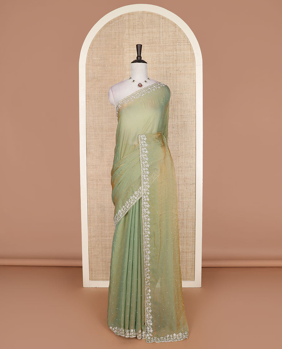 Green stone work designer saree, floral designs stone embroidered scallop border