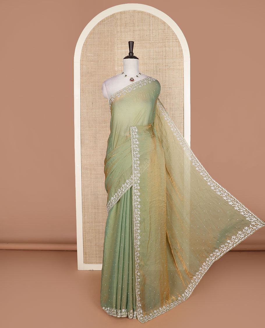 Green stone work designer saree, floral designs stone embroidered scallop border