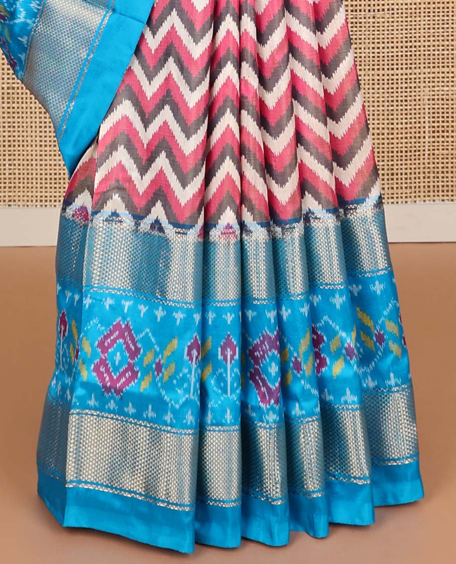 Multi- color chevron design ikkat sareee with contrast zari, floral design border & floral enclosed with checked design pallu