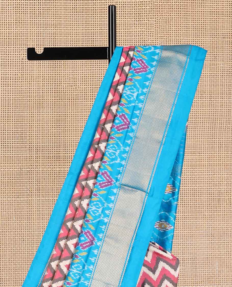 Multi- color chevron design ikkat sareee with contrast zari, floral design border & floral enclosed with checked design pallu
