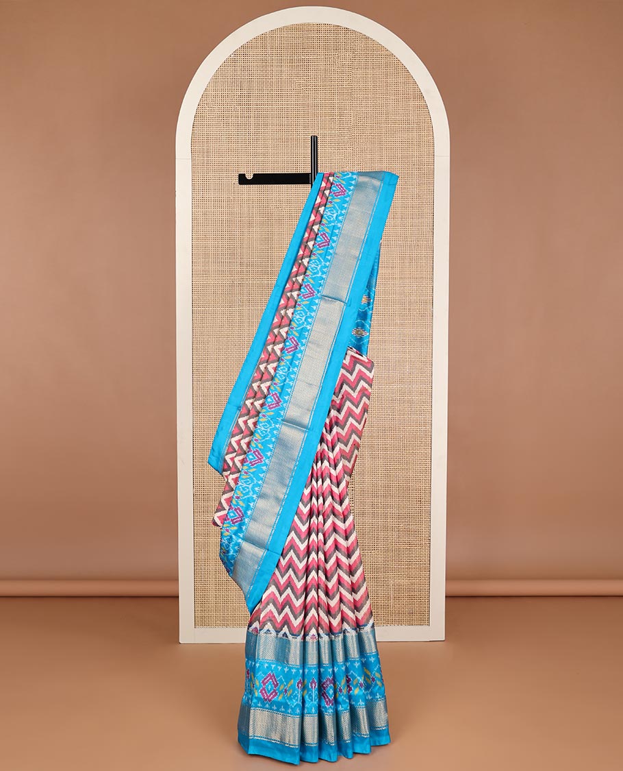 Multi- color chevron design ikkat sareee with contrast zari, floral design border & floral enclosed with checked design pallu