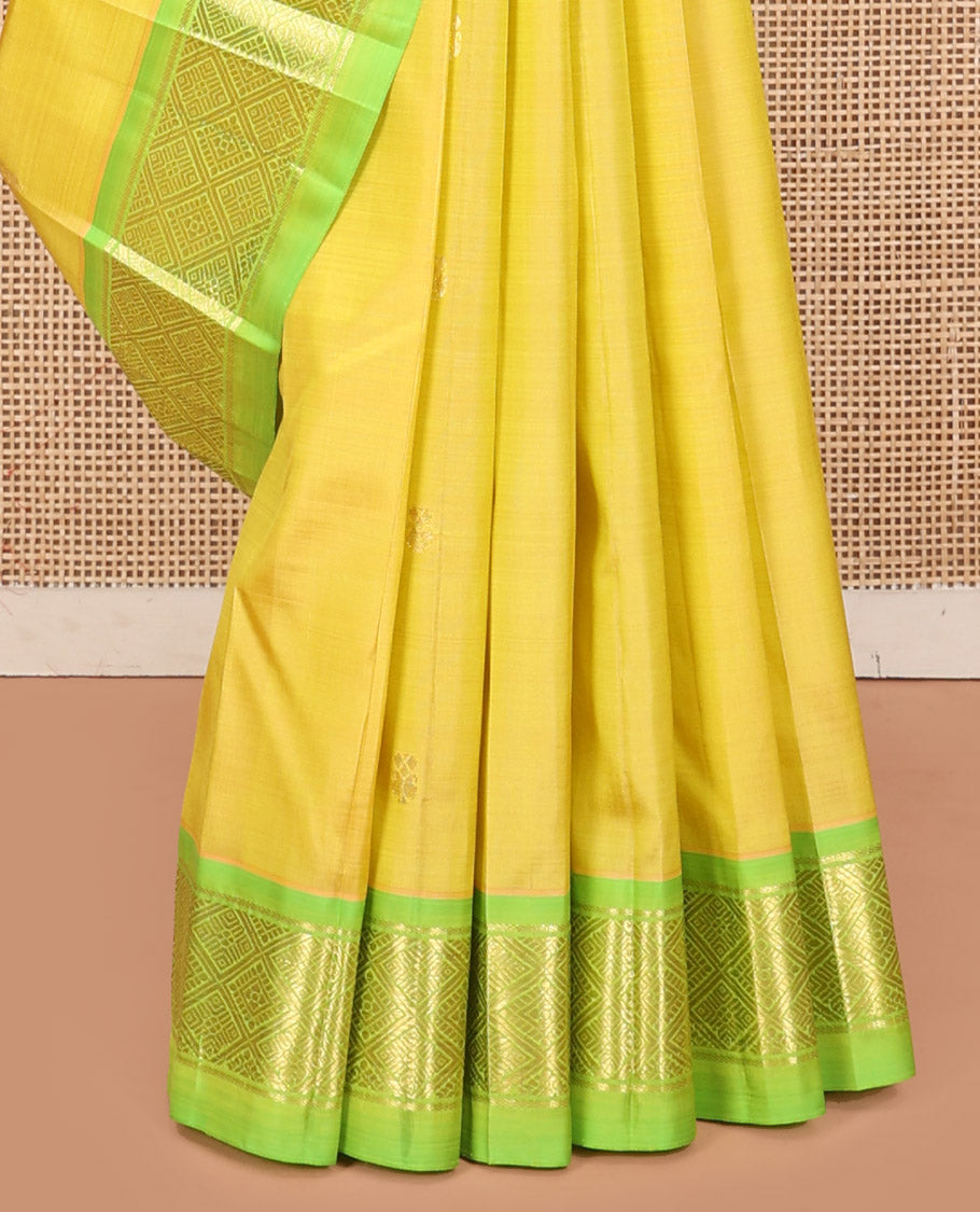 Green Kanchipuram Silk Saree, Graced with Zari Buttas, a Contrast One-Sided Jaal Design Zari Border, Zari-Woven Pallu, and No Blouse