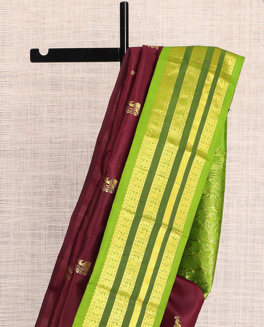 Maroon Kanchipuram Silk Saree, Graced with Zari Buttas, a Contrast Korvai One-Sided Border of Rekku, Rudraksham, Neli, and Mayil Design, Zari Design Pallu, and No Blouse