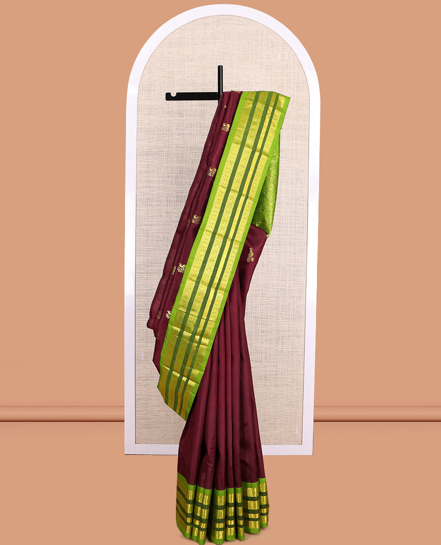 Maroon Kanchipuram Silk Saree, Graced with Zari Buttas, a Contrast Korvai One-Sided Border of Rekku, Rudraksham, Neli, and Mayil Design, Zari Design Pallu, and No Blouse