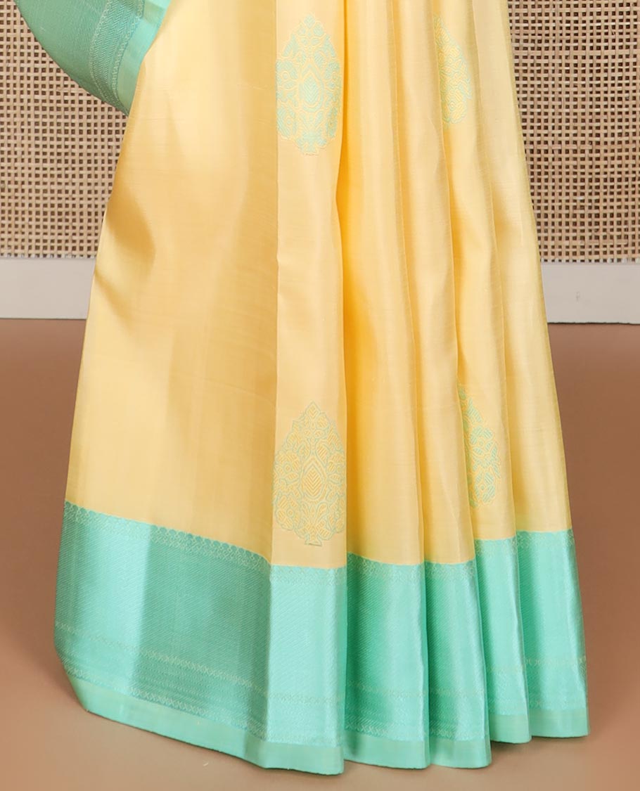 Yellow buttas kancheepuram silk saree with contrast zari design border & argyle design pallu