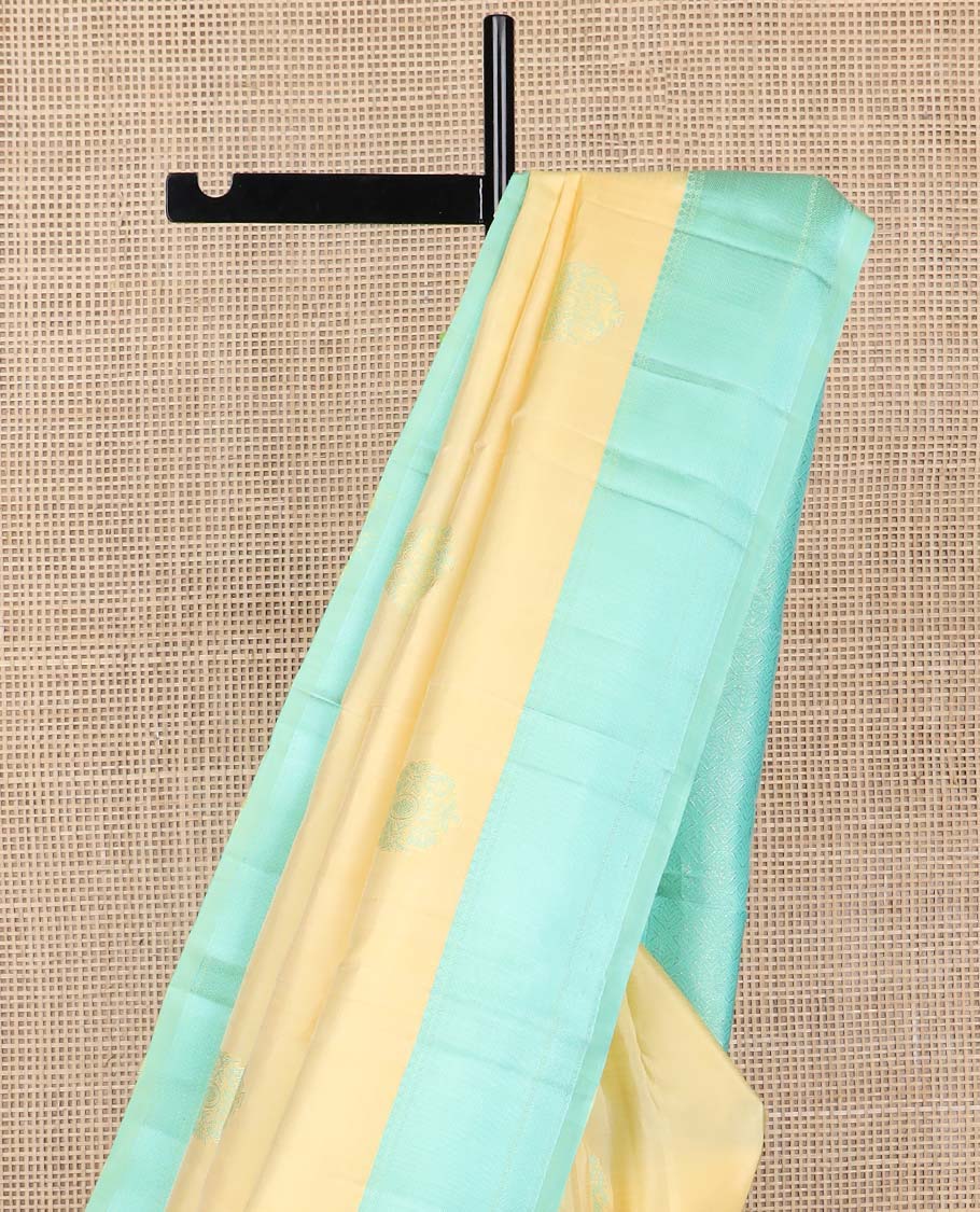 Yellow buttas kancheepuram silk saree with contrast zari design border & argyle design pallu