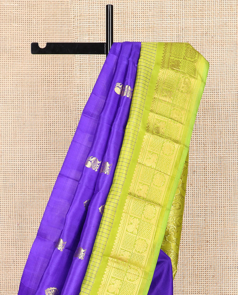 Blue zari buttas Kanchipuram silk saree, contrast thazampoo rekku checked border of mayil chakram designs, and floral design pallu