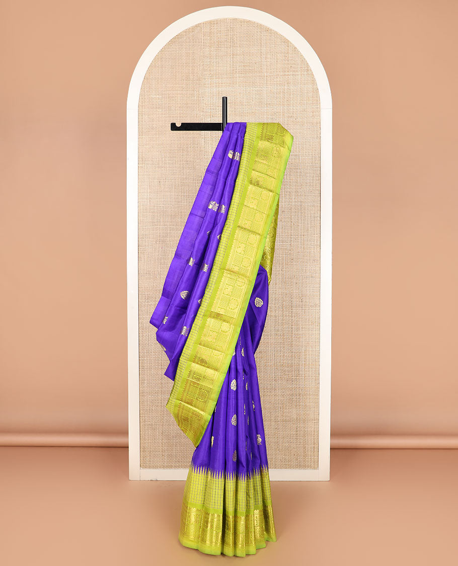 Blue zari buttas Kanchipuram silk saree, contrast thazampoo rekku checked border of mayil chakram designs, and floral design pallu