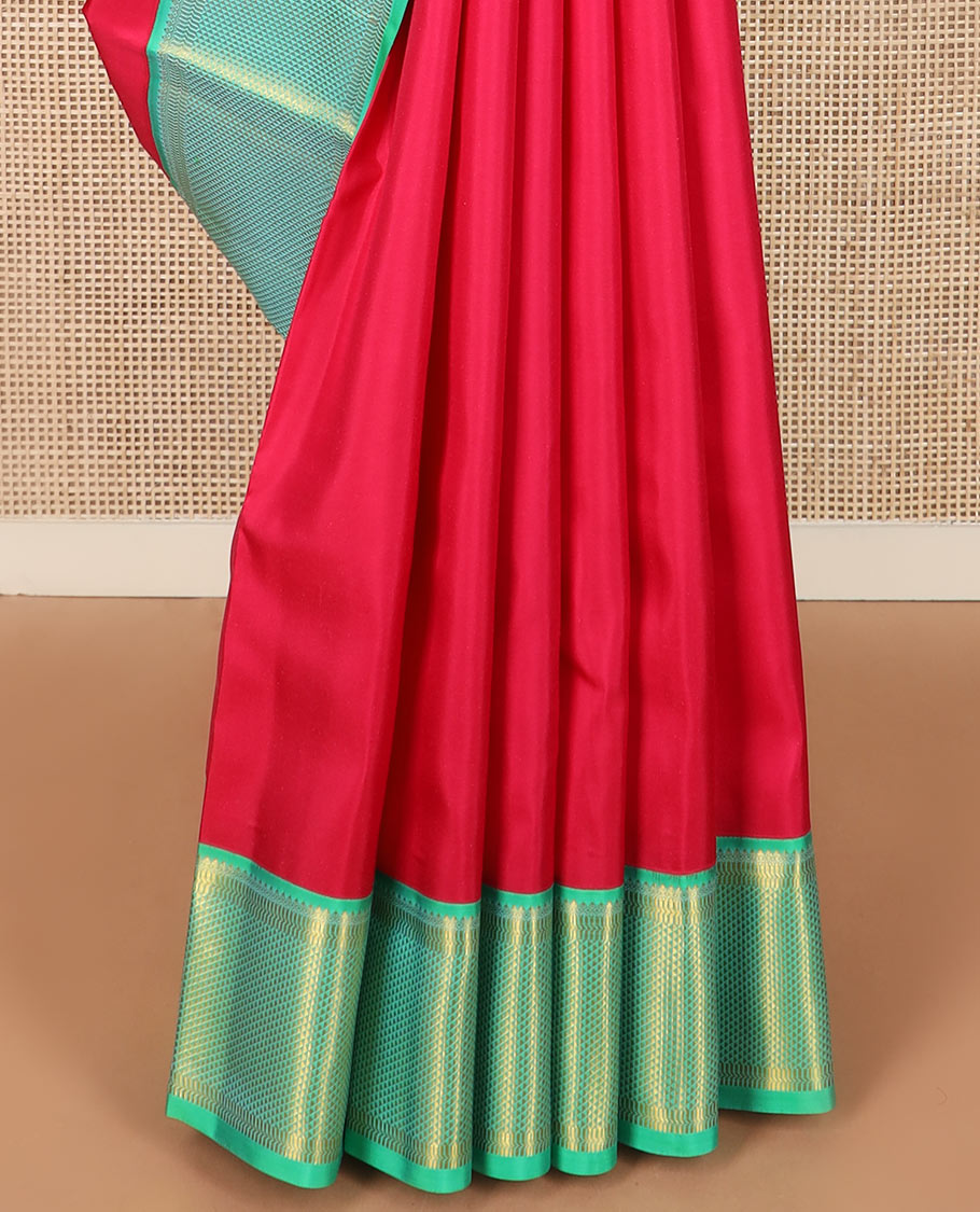 Red plain Kanchipuram silk saree, contrast border of thilakam mokku, muthu, banaras, and ara maadam designs, and ara maadam design pallu