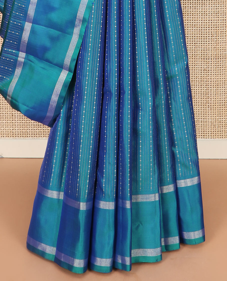 Blue zari striped Kanchipuram silk saree, contrast rettai pettu zari striped border, and jaal pallu