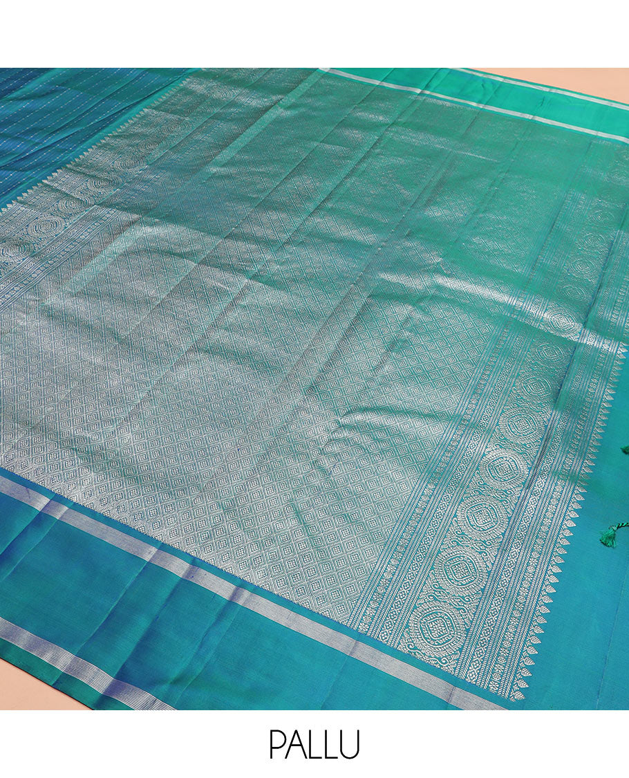 Blue zari striped Kanchipuram silk saree, contrast rettai pettu zari striped border, and jaal pallu