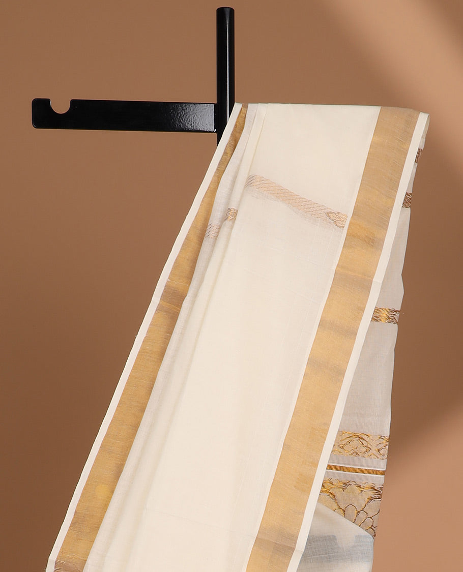 Cream kerala saree with zari stripes, plain border & pallu of floral zari designs