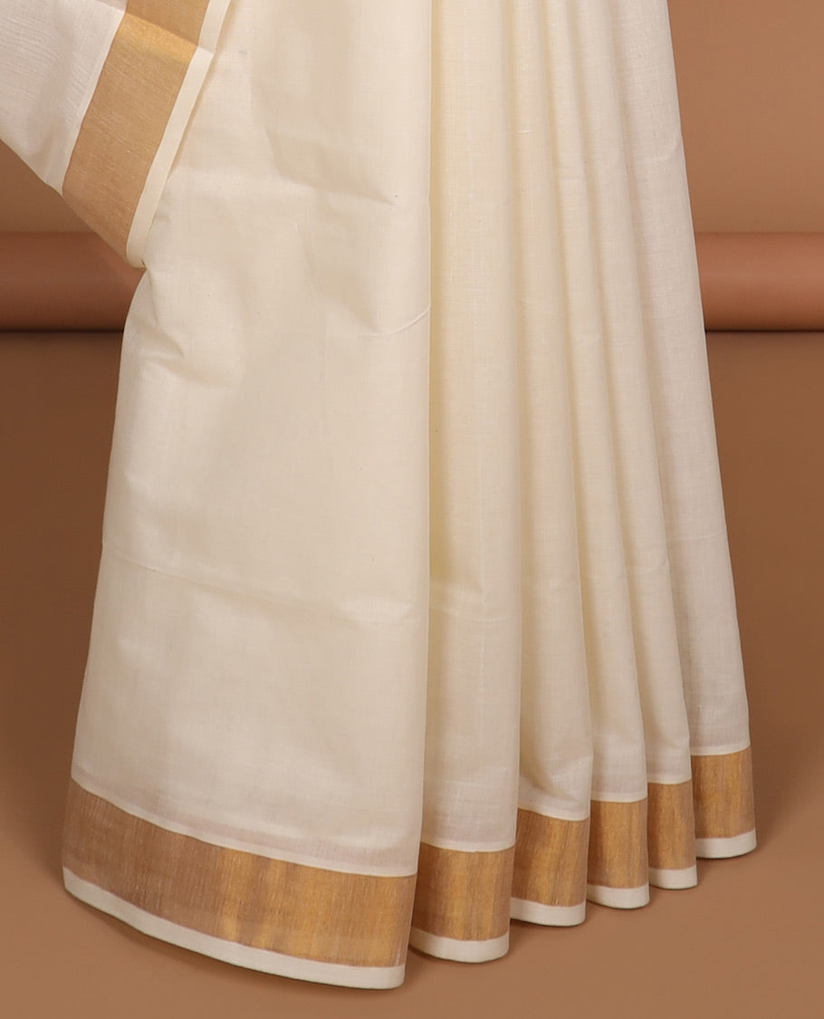 Cream kerala saree with zari stripes, plain border & pallu of floral zari designs